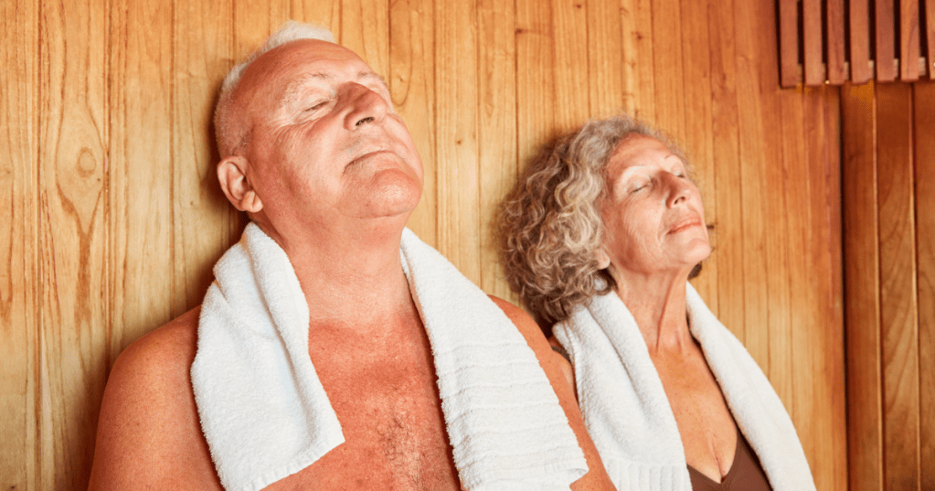 Two people enjoying deep relaxation in a hot wooden sauna